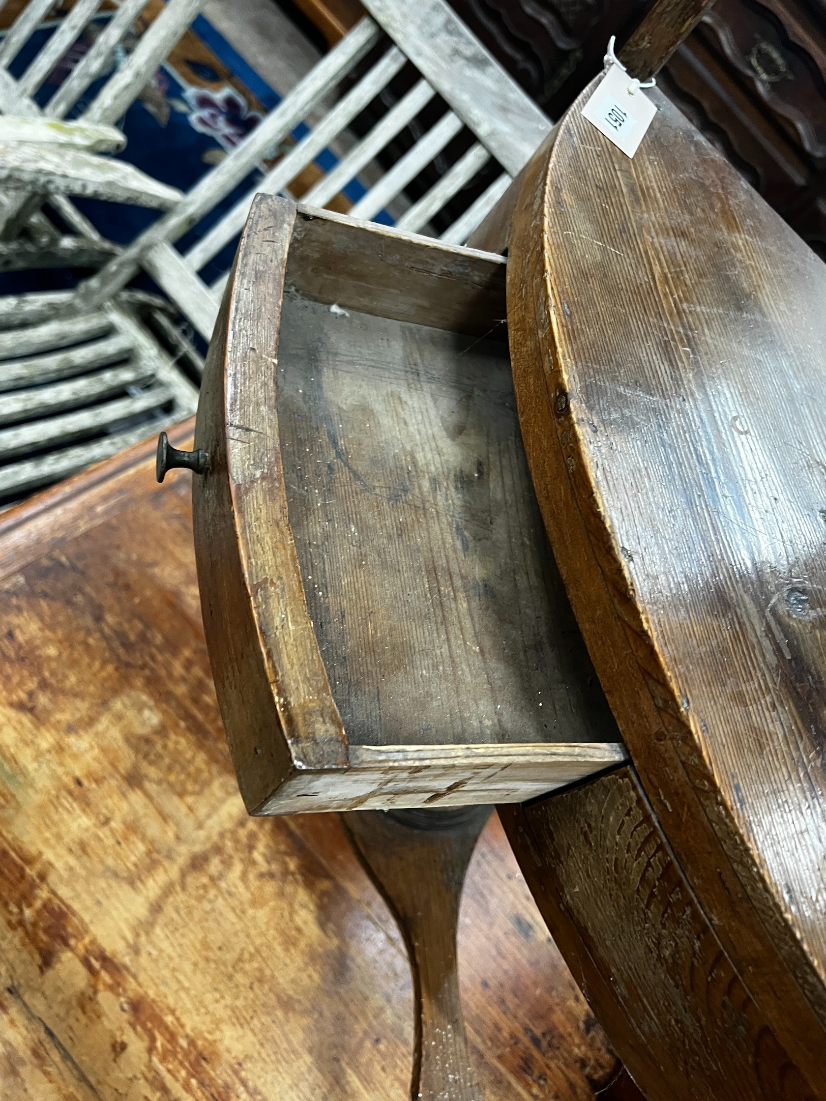 A George III pine bowfront three tier corner washstand, width 60cm depth 40cm height 80cm